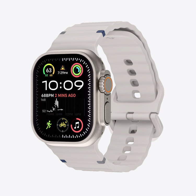 Smartwatch with a dune band on a light gray background