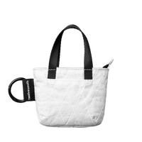 White quilted tote bag with black handles and a visible brand logo on a white background