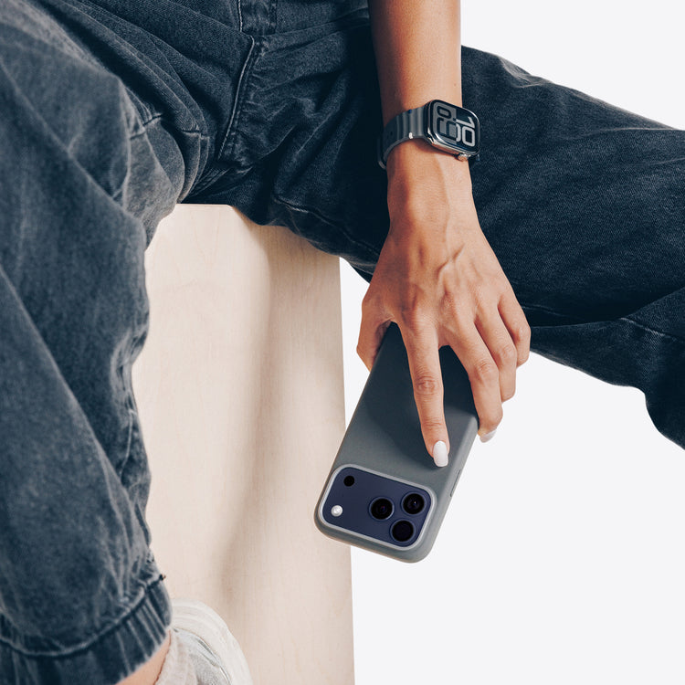Person holding a smartphone with a blurred background