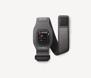 A dark gray smartwatch band with a built-in watch face and a matching adjustable strap accessory, shown on a clean off-white background. The band has the brand name 'ActionSleeve' printed near the bottom.
