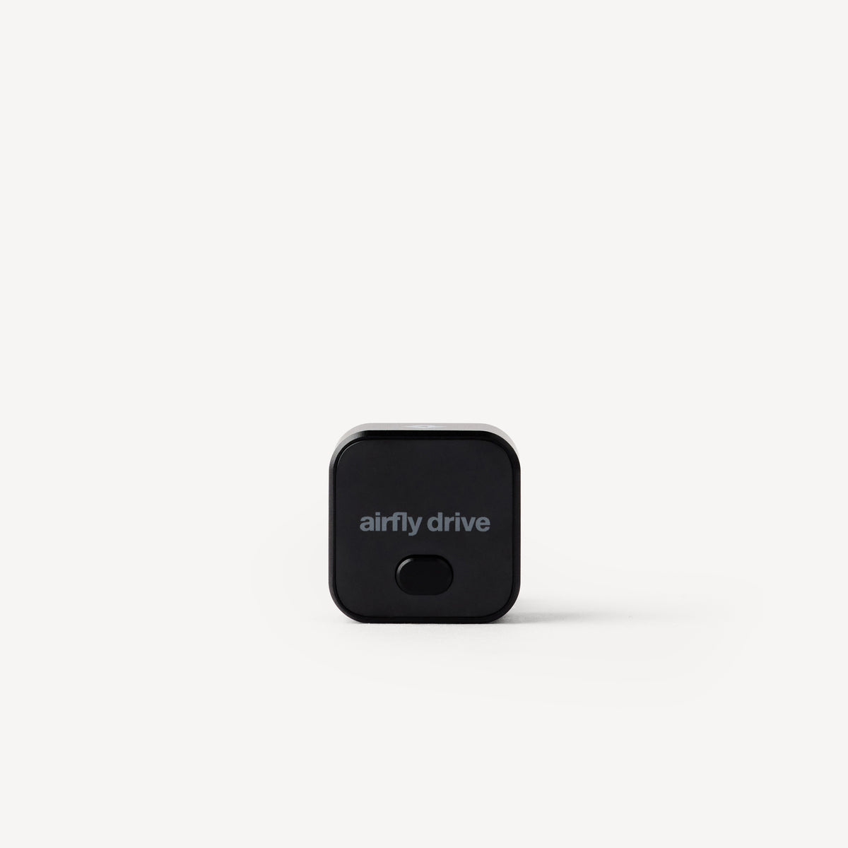 A small black square electronic device with rounded corners and the text 'airfly drive' printed on the front, centered on a light gray background.