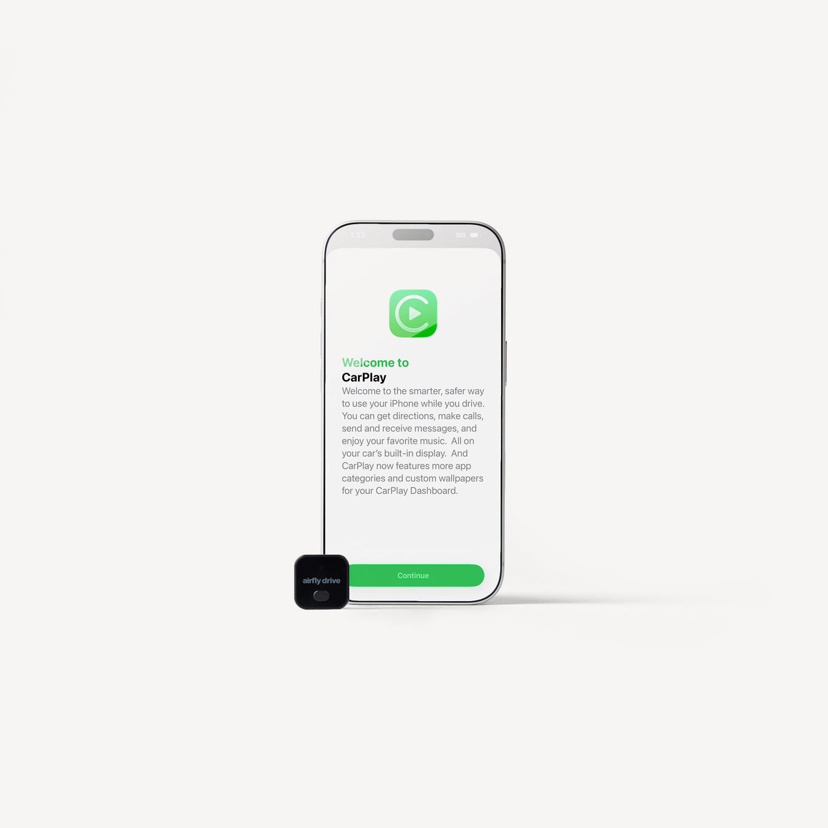 A smartphone centered on a light gray background with a small black CarPlay device in front of it. The phone screen shows the CarPlay welcome interface with a green logo and text.