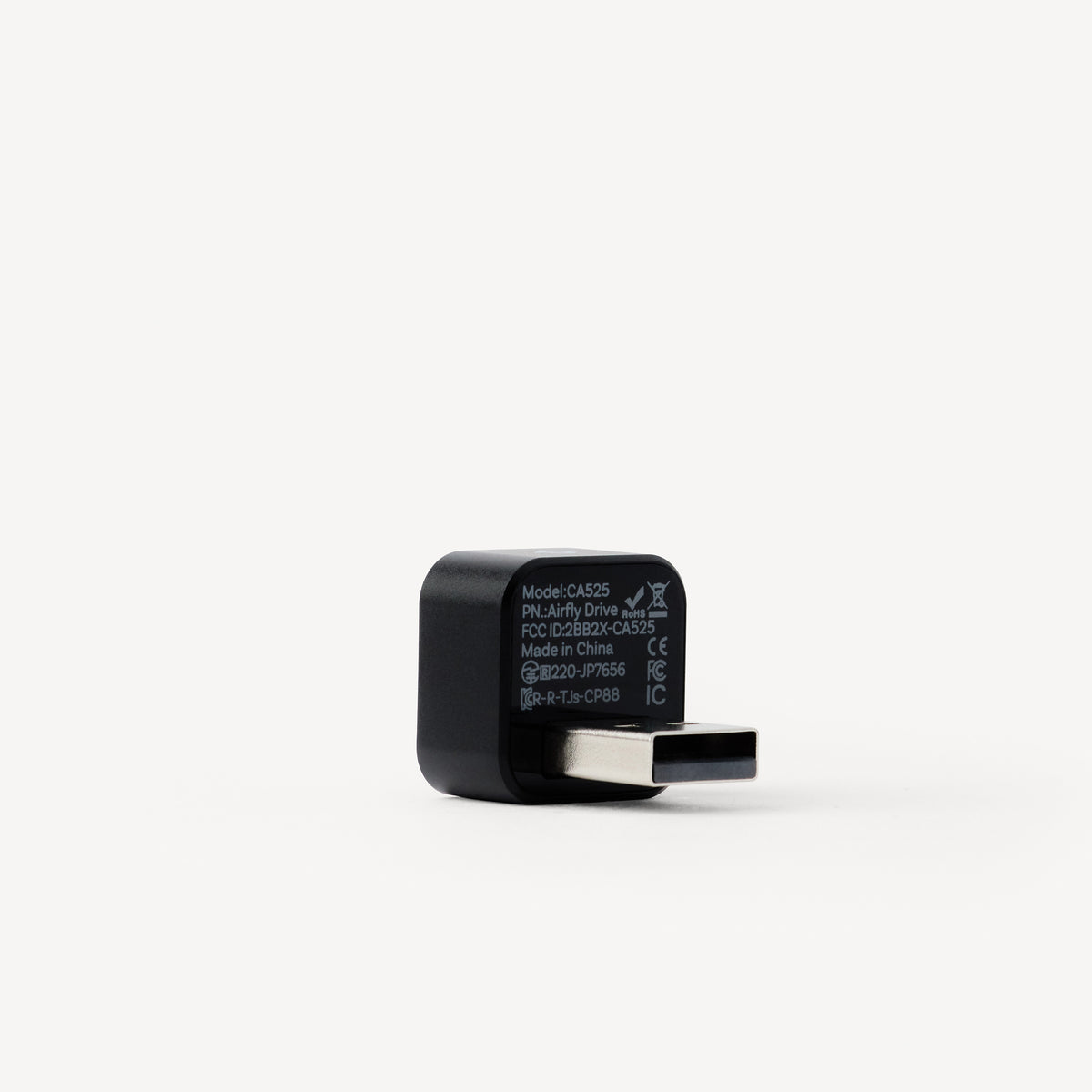 A black USB-C to USB-A adapter with white printed specifications on its side, shown on a clean white background.