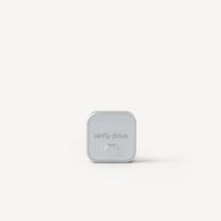 A small square silver device with rounded corners and the text 'airfly drive' on the front, centered on a clean white background.
