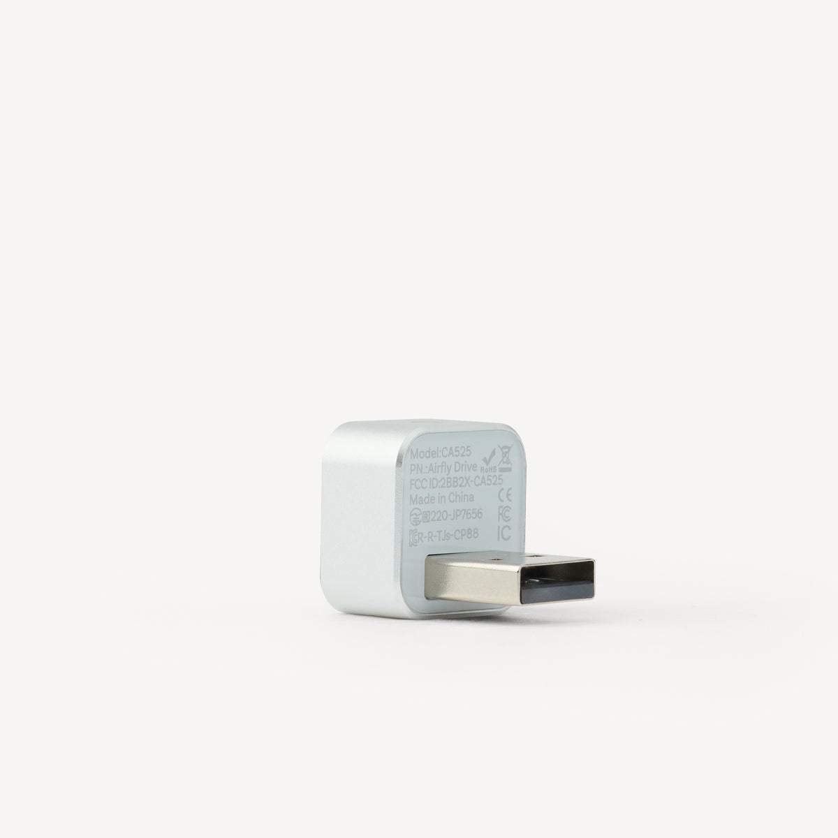 A small white USB-C power adapter with a USB-C connector, photographed on a clean white background.